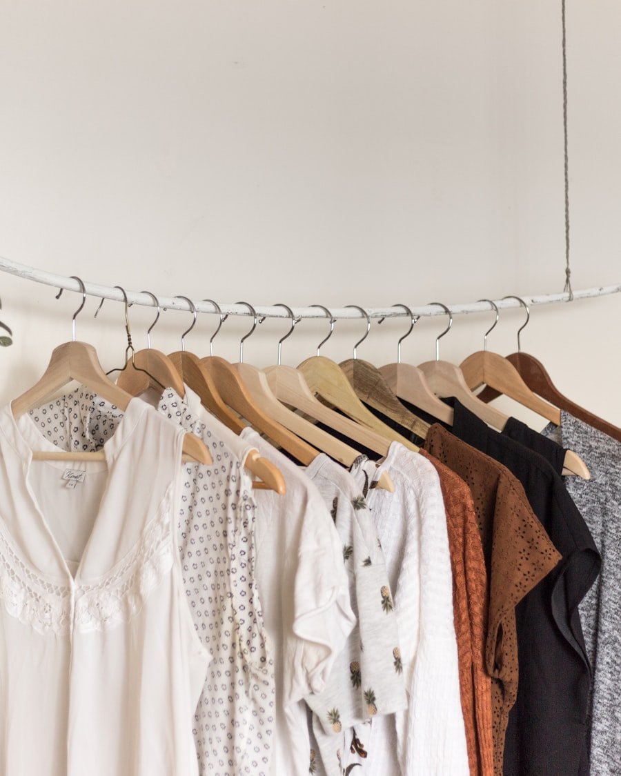 Assorted clothing on wooden hangers